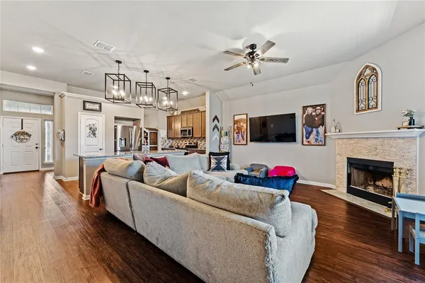 a living room with furniture and a fireplace