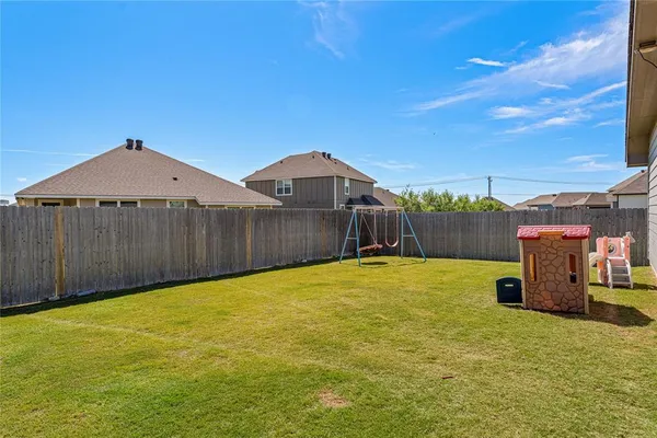a view of a backyard with a small cabin