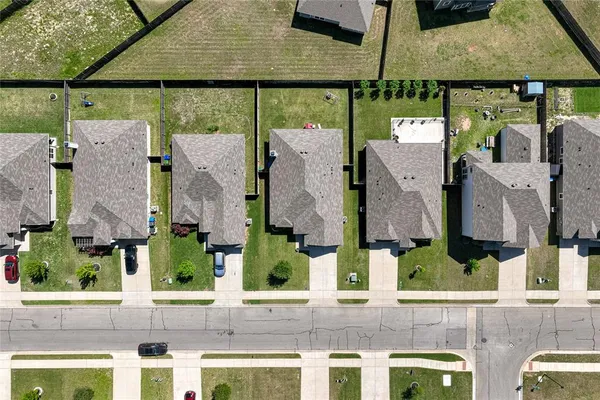 an aerial view of houses with outdoor space