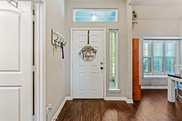 a view of front door with wooden floor
