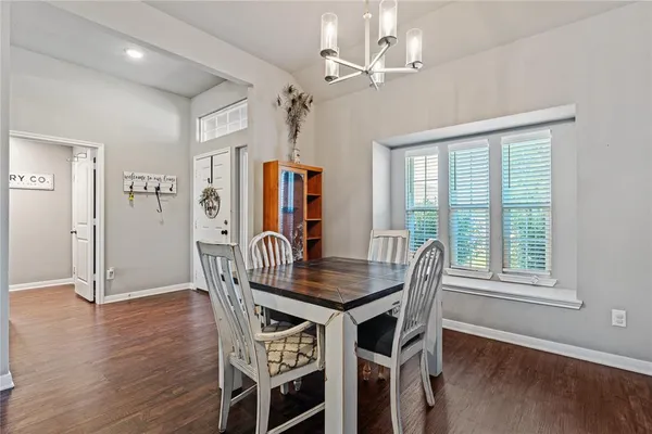 a dining room with furniture window wooden floor