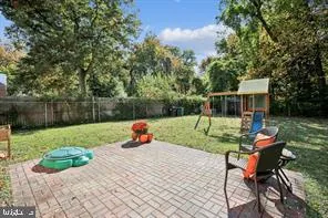 a view of backyard with a table and chairs