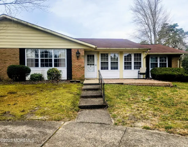 a front view of a house having yard
