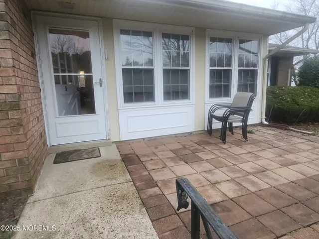 a bench sitting in front of a house