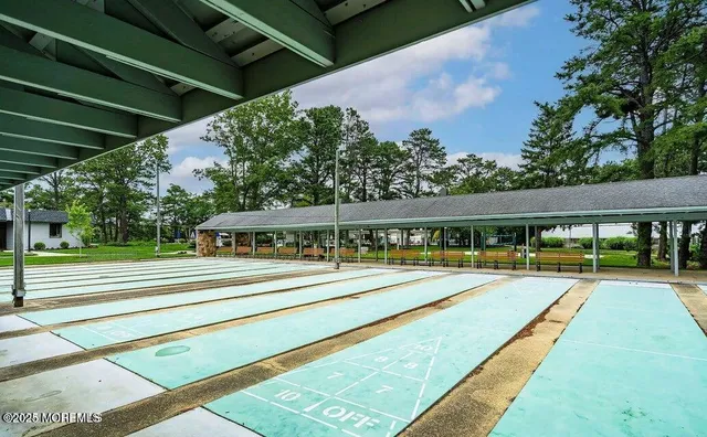 a view of an house with swimming pool and deck