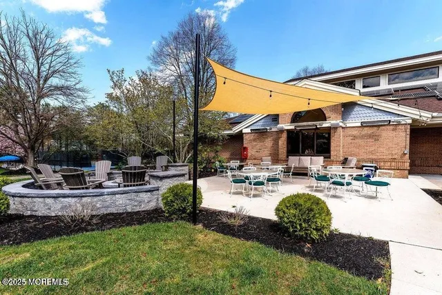 a view of a backyard with sitting area