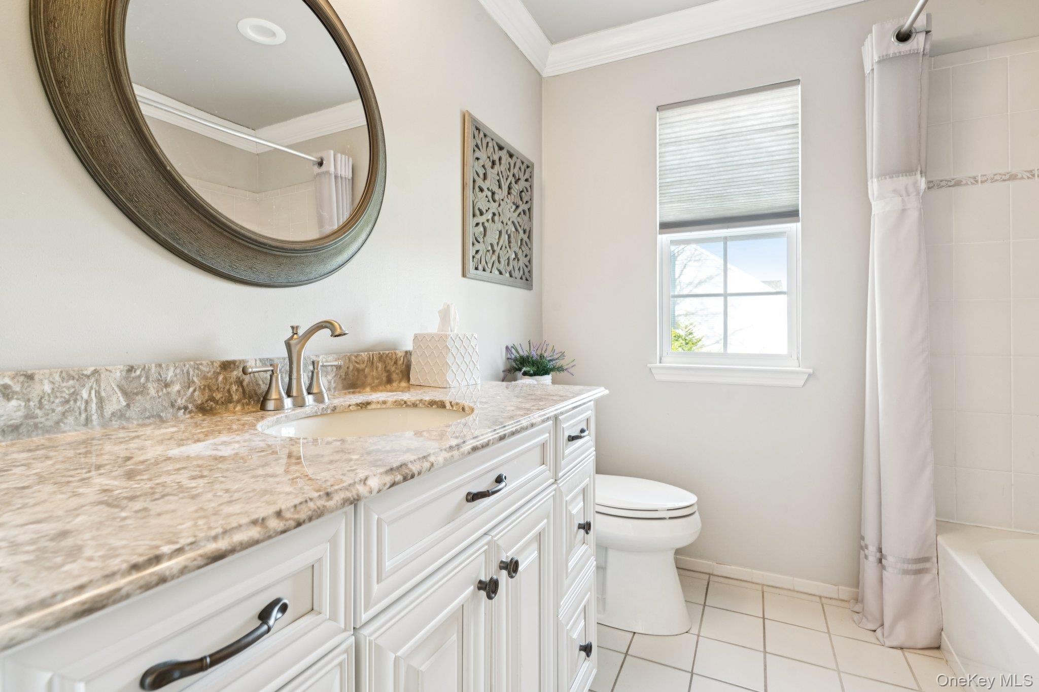 7 Brittany Court Ridge, NY 11961 - Photo 25 of 45 Bathroom featuring vanity, crown molding, shower / tub combo with curtain, and light tile patterned floors