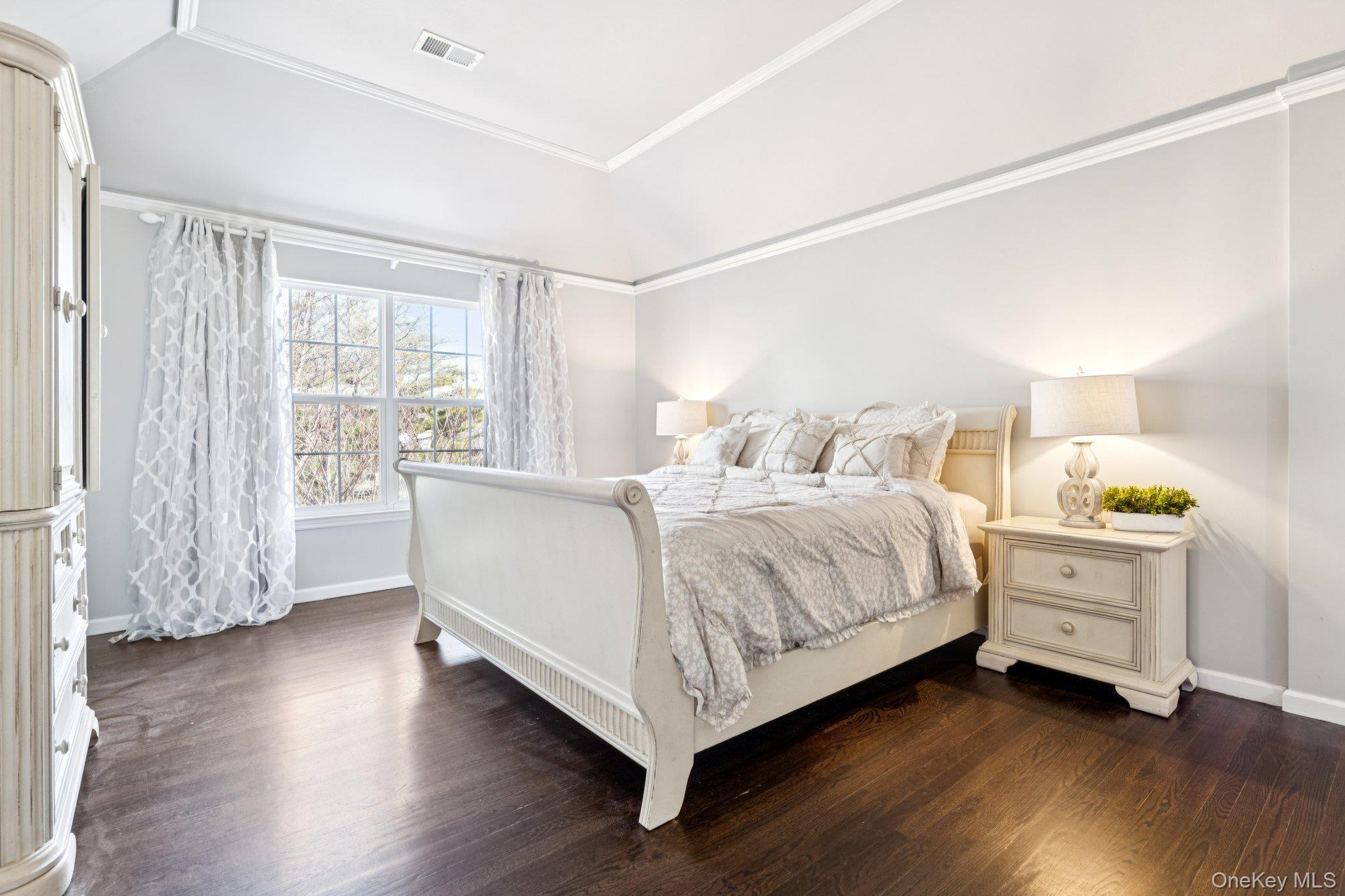 7 Brittany Court Ridge, NY 11961 - Photo 29 of 45 Bedroom with dark wood-style flooring and ornamental molding