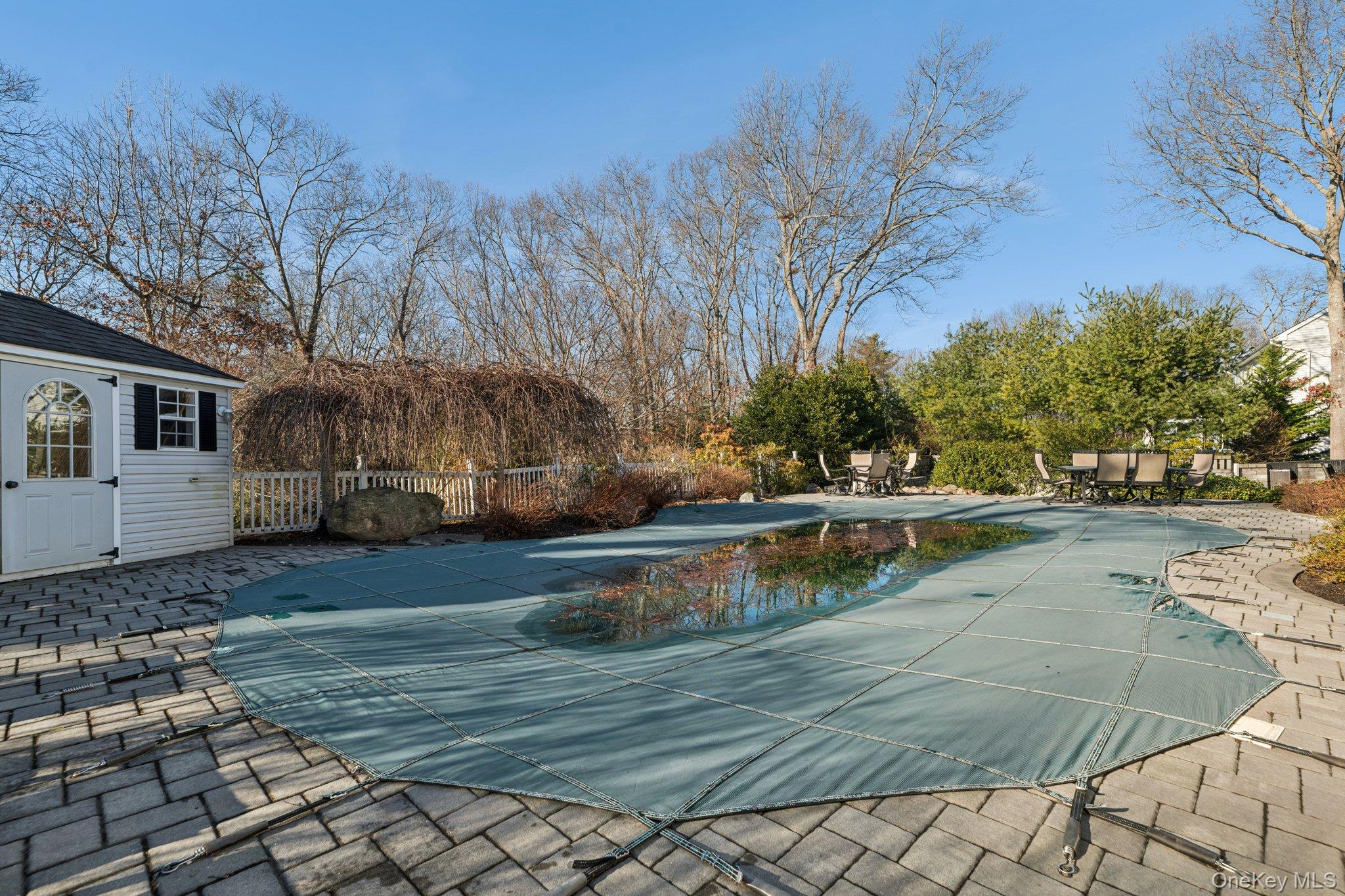 7 Brittany Court Ridge, NY 11961 - Photo 34 of 45 View of swimming pool featuring a patio and an outbuilding