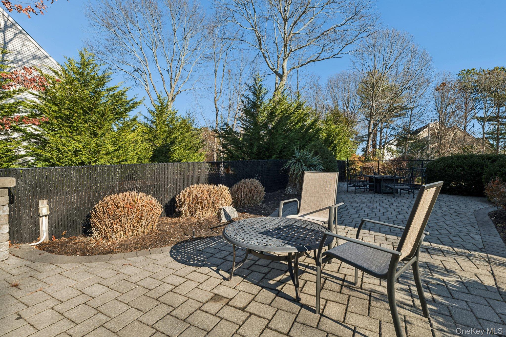 7 Brittany Court Ridge, NY 11961 - Photo 35 of 45 Fenced backyard with a patio area and outdoor dining area