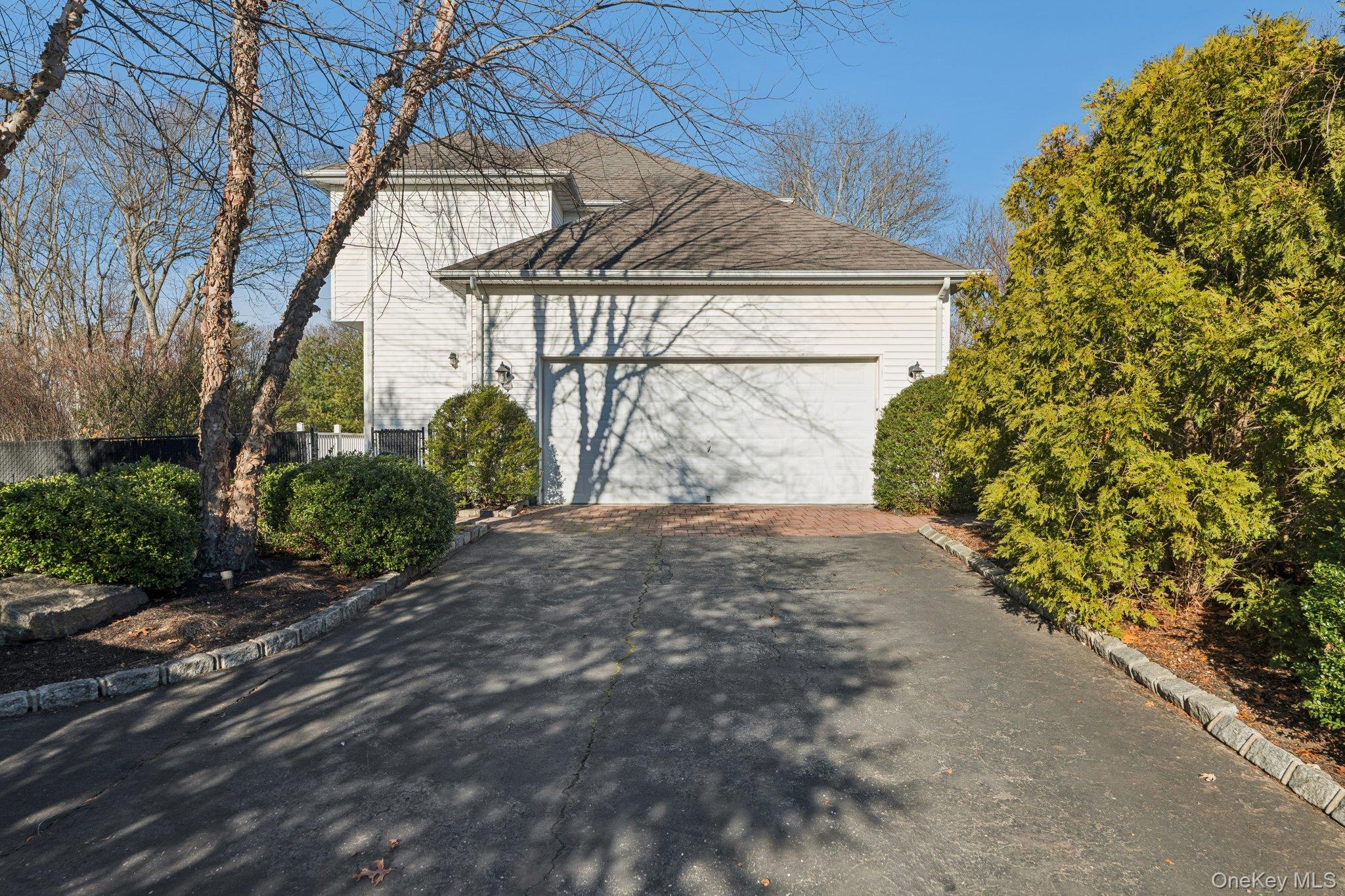 7 Brittany Court Ridge, NY 11961 - Photo 5 of 45 View of home's exterior featuring driveway
