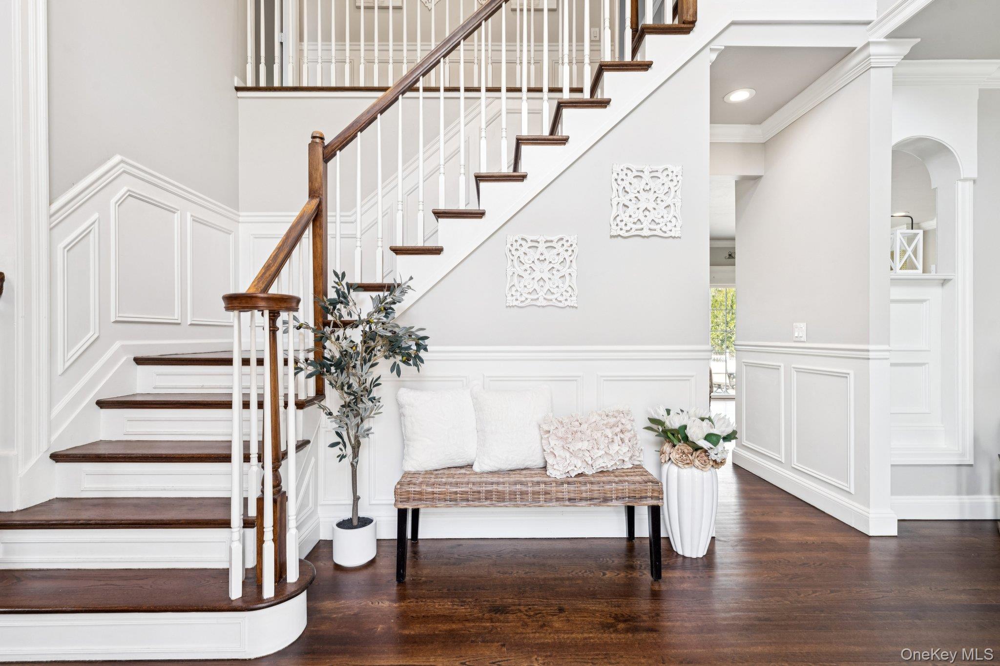 7 Brittany Court Ridge, NY 11961 - Photo 6 of 45 Stairway featuring a decorative wall, wood finished floors, a wainscoted wall, and ornamental molding