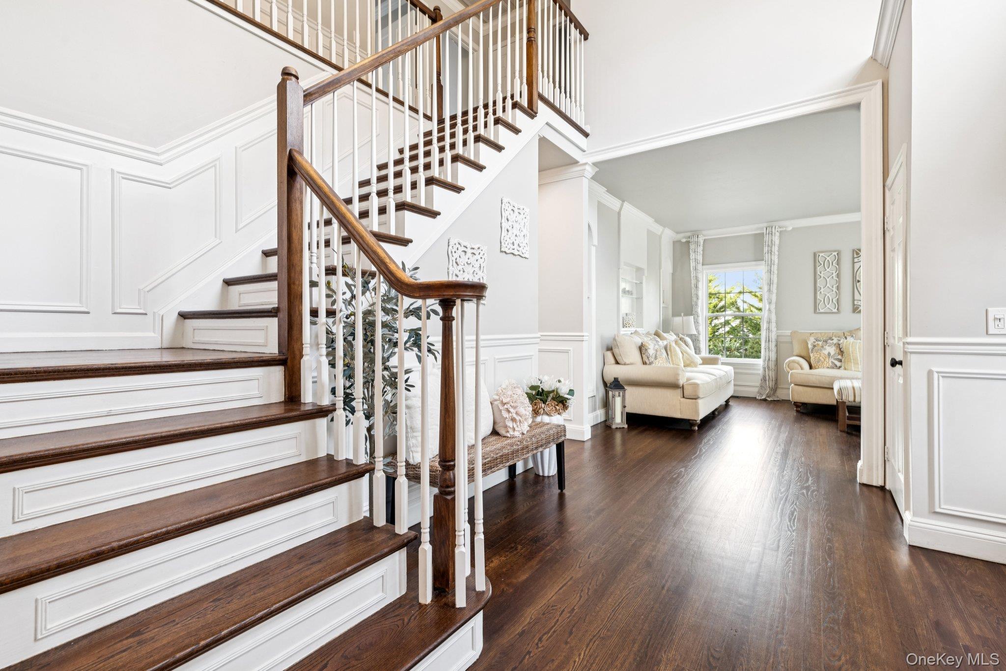 7 Brittany Court Ridge, NY 11961 - Photo 7 of 45 Stairs with a decorative wall, a wainscoted wall, wood finished floors, and ornamental molding