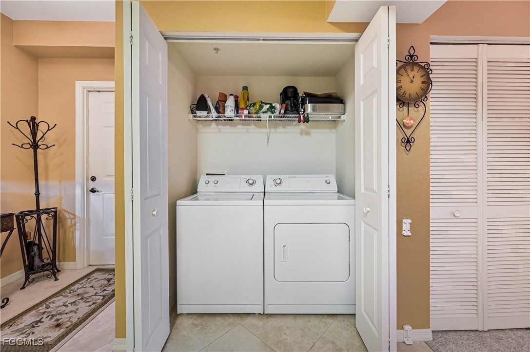 20201 Estero Gardens Circle, Unit 103 Estero, FL 33928 - Photo 26 of 33 a utility room with dryer and washer