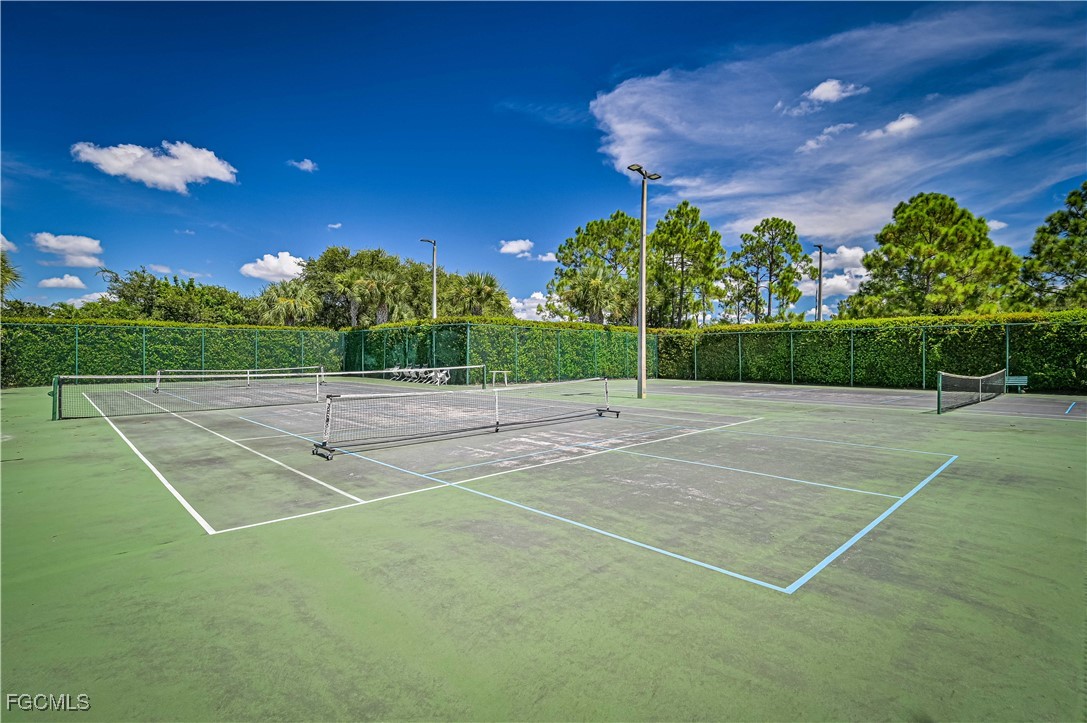 20201 Estero Gardens Circle, Unit 103 Estero, FL 33928 - Photo 33 of 33 a view of a tennis court