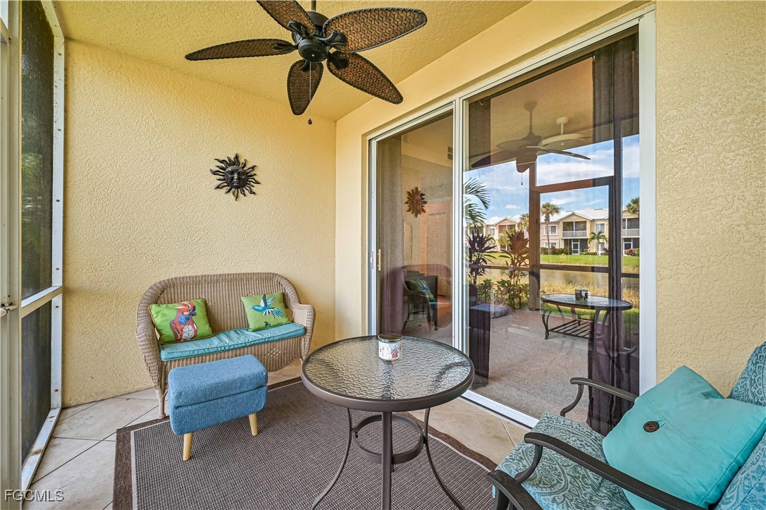 20201 Estero Gardens Circle, Unit 103 Estero, FL 33928 - Photo 7 of 33 a living room with furniture and a window