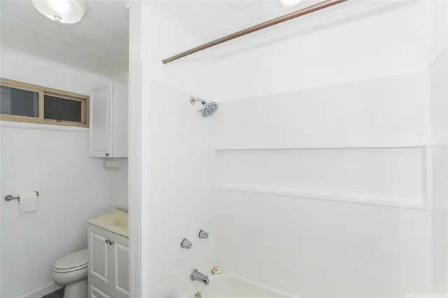 a bathroom with a shower and a toilet