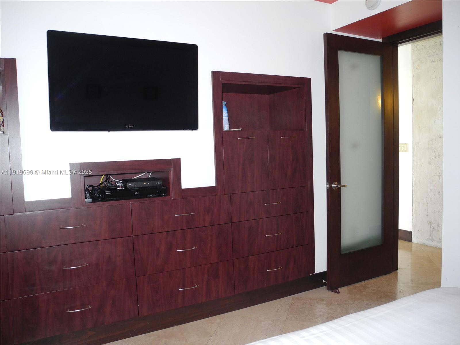 1408 Brickell Bay Drive, Unit 612 Miami, FL 33131 - Photo 15 of 27 a bathroom with a sink and a mirror