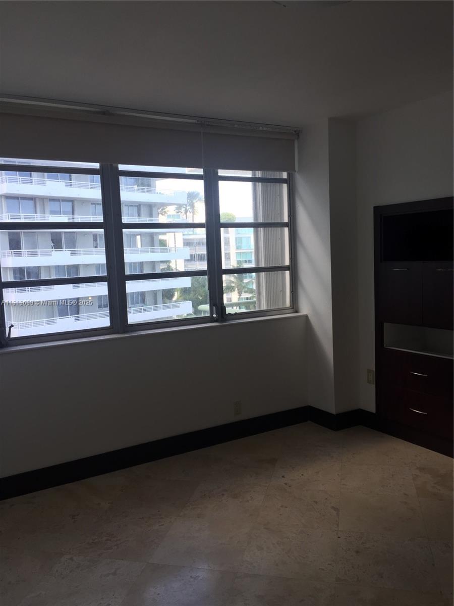 1408 Brickell Bay Drive, Unit 612 Miami, FL 33131 - Photo 16 of 27 a view of an empty room with a window
