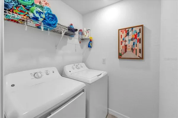 a living room with furniture rug and window