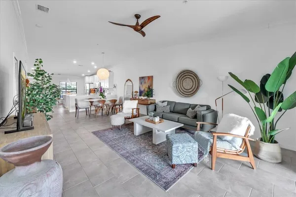 a view of a chairs and table in the balcony