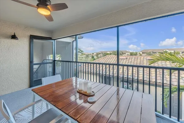 an aerial view of a swimming pool and outdoor seating