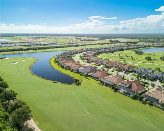 a front view of a house with garden and trees