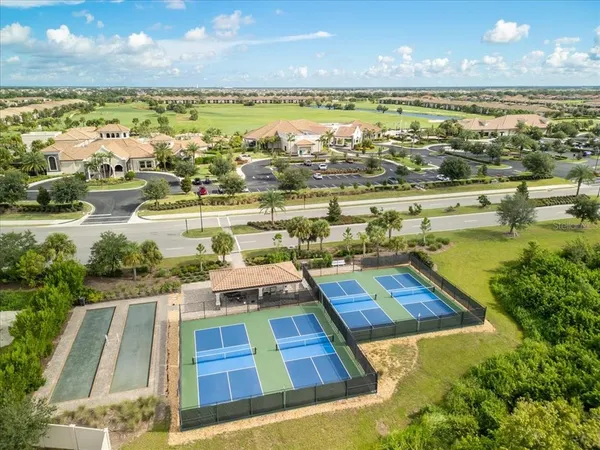 an aerial view of residential houses with outdoor space
