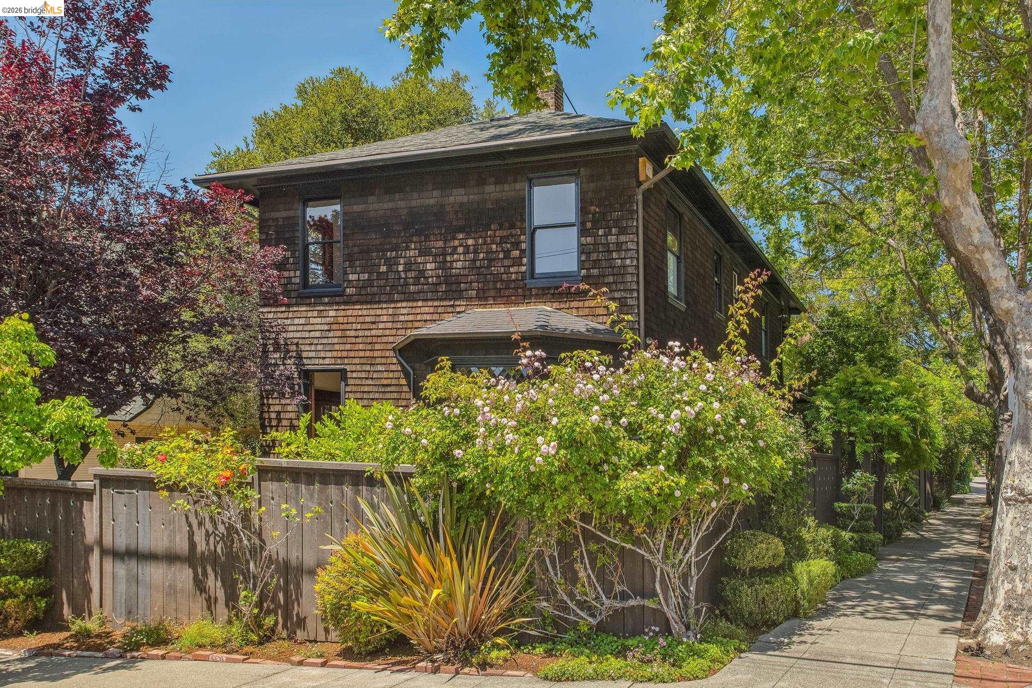 1490 Arch Street Berkeley, CA 94708 - Photo 2 of 57 a front view of a house with a yard