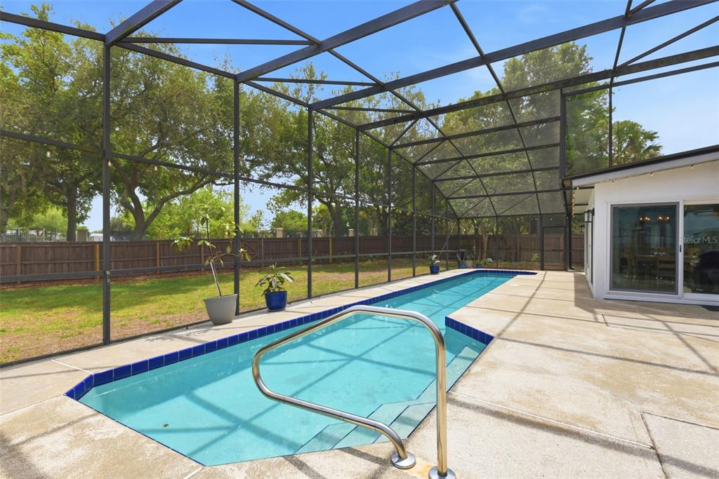 7432 Sparkling Lake Road Orlando, FL 32819 - Photo 36 of 54 a view of a backyard with swimming pool