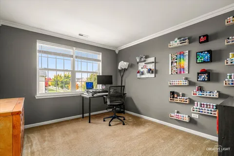 a workspace with furniture and a window