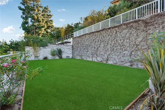 a view of a porch and garden