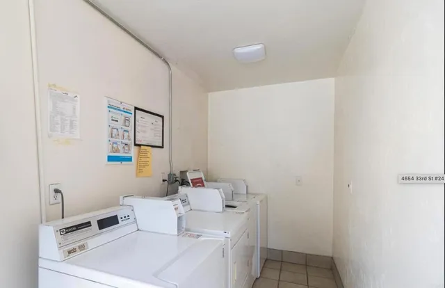 a bathroom with a sink mirror and vanity