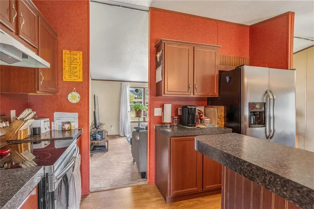a kitchen with a sink and a refrigerator