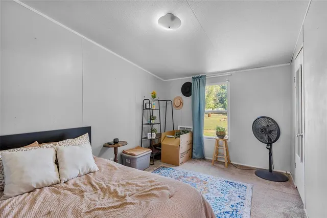 a bathroom with a granite countertop sink a toilet and a mirror