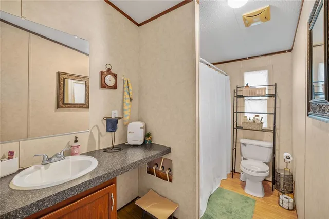 a bedroom with a bed lamp and a window