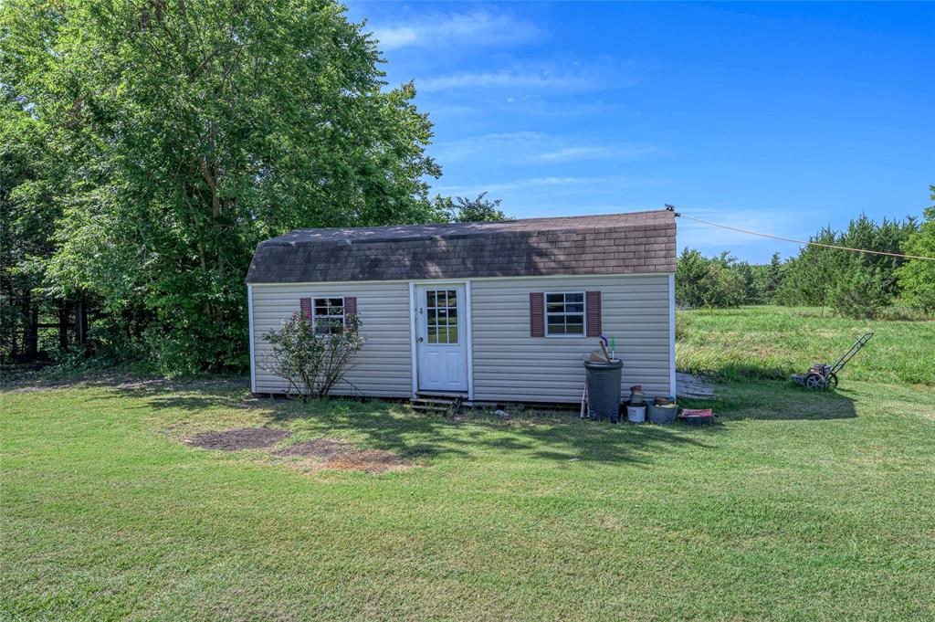 428 Pennell Road Sherman, TX 75090 - Photo 25 of 39 a view of a house with a yard