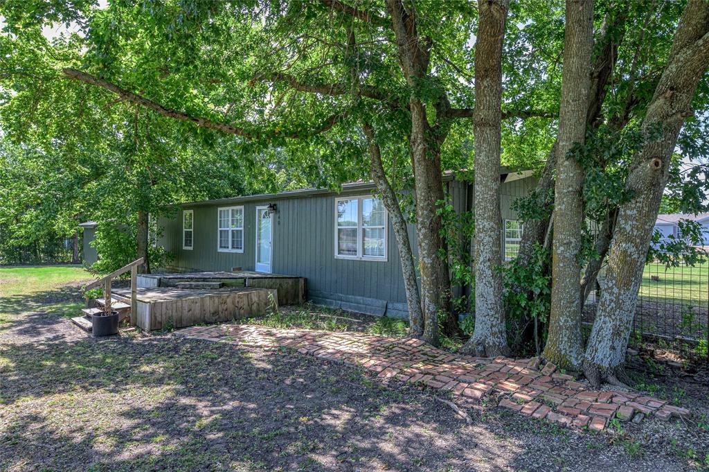 428 Pennell Road Sherman, TX 75090 - Photo 33 of 39 a view of a house with a backyard and a tree