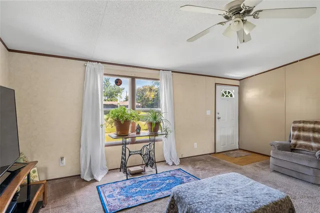 a view of a livingroom with furniture