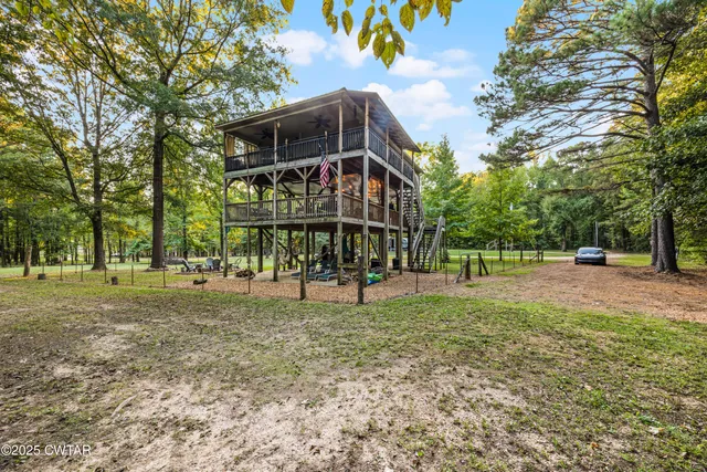 a view of a park with large trees