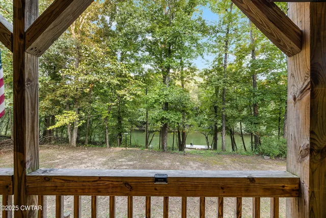 a view of a pathway with a wrought fence