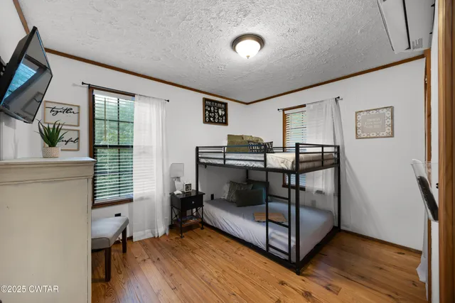 a bedroom with furniture and window