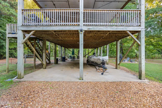 a view of a patio with a table chairs and a porch