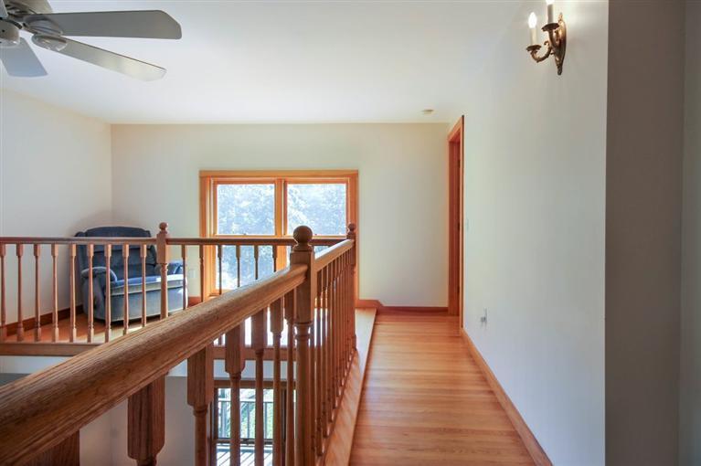73 Pennywise Path Edgartown, MA 02539 - Photo 16 of 26 a view of a balcony with wooden floor