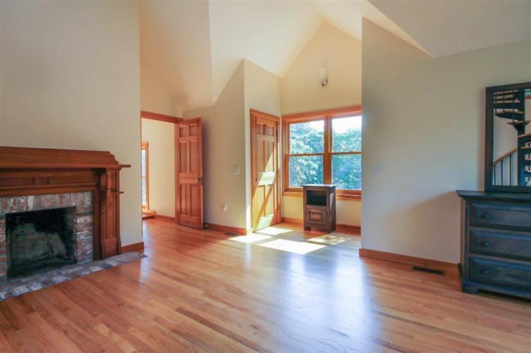73 Pennywise Path Edgartown, MA 02539 - Photo 17 of 26 a view of an empty room with wooden floor fire place and windows