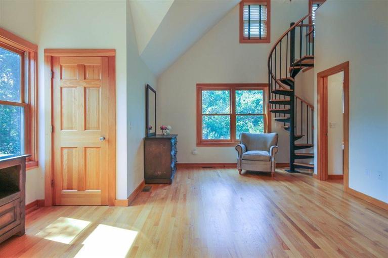 73 Pennywise Path Edgartown, MA 02539 - Photo 19 of 26 a living room with furniture floor to ceiling window and wooden floor