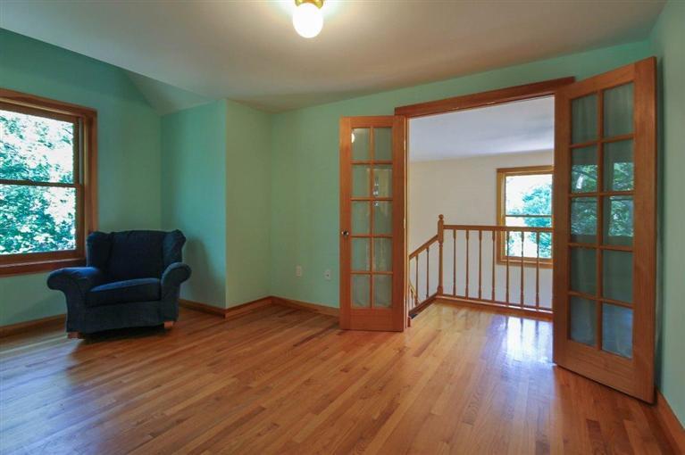 73 Pennywise Path Edgartown, MA 02539 - Photo 21 of 26 a view of a livingroom with furniture wooden floor and windows