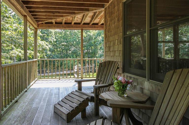 73 Pennywise Path Edgartown, MA 02539 - Photo 7 of 26 a view of a chairs and table in patio next to a yard