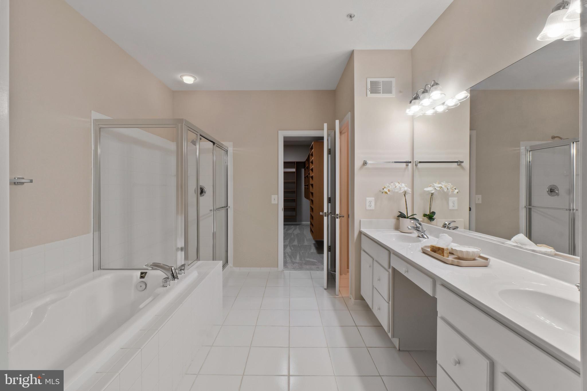8220 Academy Road, Unit 22 Ellicott City, MD 21043 - Photo 19 of 42 Primary bathroom with soaking tub and shower