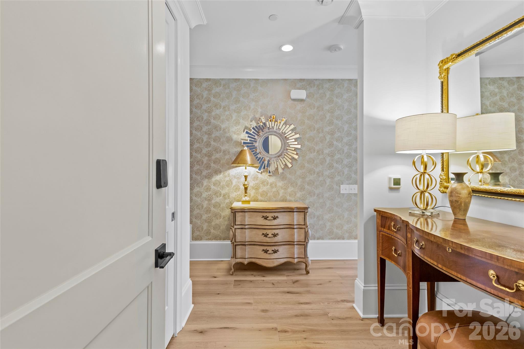 1500 Queens Road, Unit 104 Charlotte, NC 28207 - Photo 4 of 41 a view of a bedroom with wooden floor and cabinet